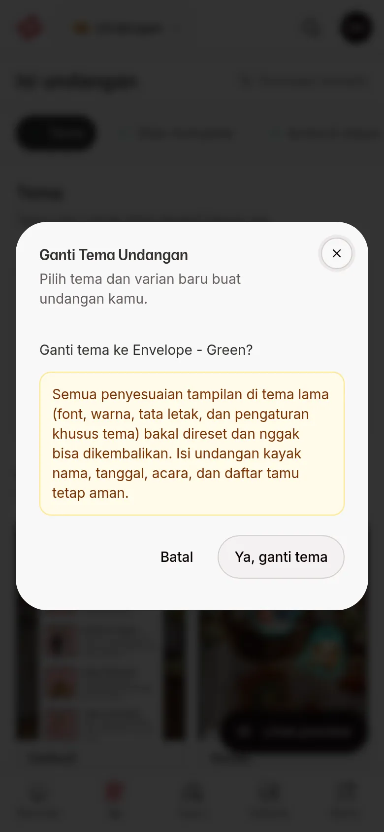 Konfirmasi ganti tema berisi peringatan bahwa penyesuaian tampilan tema lama direset, dengan tombol Batal dan Ya, ganti tema