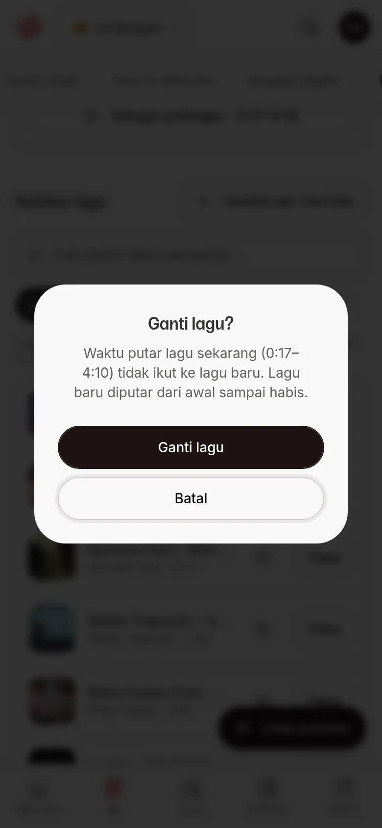 Dialog Ganti lagu? dengan tombol Ganti lagu dan Batal